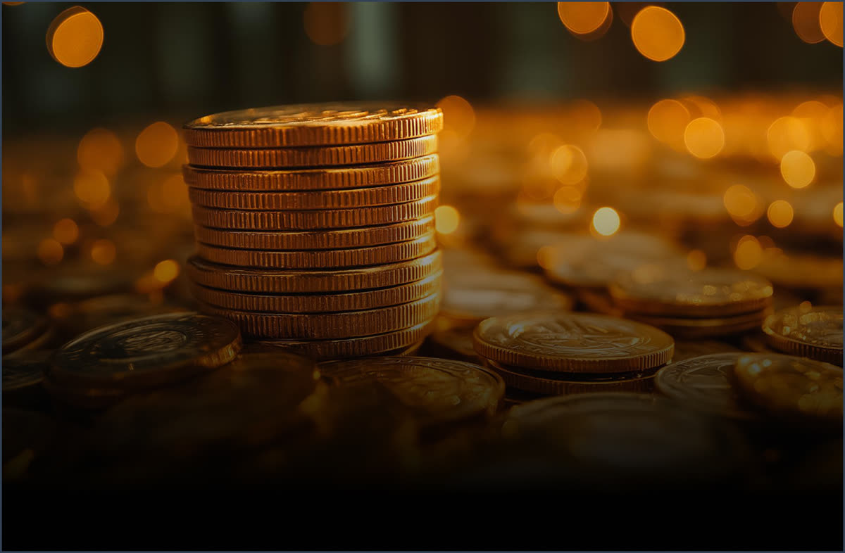 A tall stack of gold investment coins